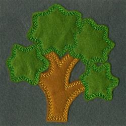 Applique tree with star-shaped green leaves and a sturdy brown trunk, perfect for playful children's decor.