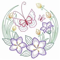 Colorful butterfly applique with intricate pink details, surrounded by vibrant purple and yellow flowers and green leaves.