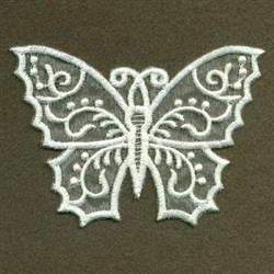 Intricate butterfly design with symmetrical wings, delicate white thread on dark background, showcasing ornamental details.