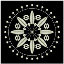 Floral design with symmetrical elements in a quilted, circular layout. Detailed light flowers and leaves contrast against a b