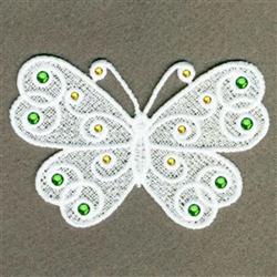 FSL butterfly crafted from delicate white lace, featuring intricate green and yellow embellishments.