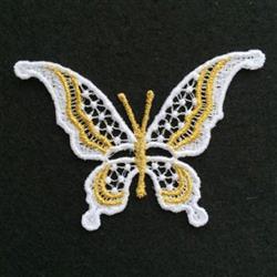 FSL butterfly with delicate yellow and white lace details, featuring intricate patterns against a dark background.