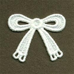 FSL decorative bow in vibrant white showcases delicate lace-like texture and intricate details against a dark background.