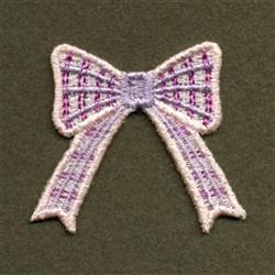 FSL decorative bow in whimsical purple and white textured fabric, set against a dark green background.