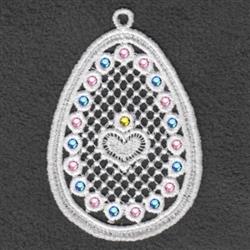 FSL decorative egg with delicate lace, adorned in pastel gems and heart design, perfect for Easter.