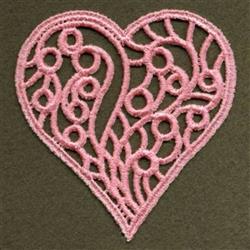 FSL heart filled with delicate pink loop designs, showcasing intricate embroidery on a darker backdrop.