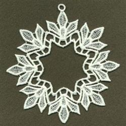 FSL decorative lace design featuring an intricate leaf motif in a circular shape, finely detailed against a dark background.