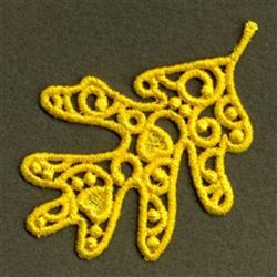 FSL leaf with intricate lace-like detailing in bright yellow thread featuring delicate curves and loops, perfect for autumn.