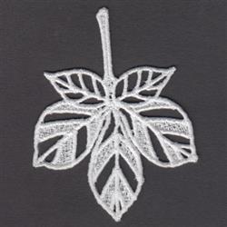 FSL leaf lace showcasing delicate symmetry, fine details, and a transparent appearance on a dark background.