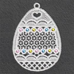 FSL ornamental egg with delicate lace patterns, colorful gems, and a hanging loop, perfect for Easter decorations.