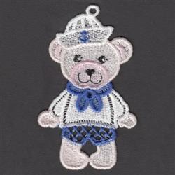 FSL bear in a sailor outfit with a pink face, white hat, blue scarf, and striped shirt, exuding a playful charm.
