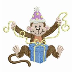 Colorful birthday monkey wearing a polka dot hat, sitting on a blue gift box with yellow ribbon and streamers.