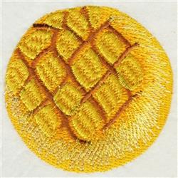 Realistic pineapple embroidery with vibrant yellow hues, textured skin, and circular shapes, great for kitchen decor.