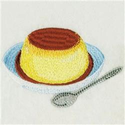 Colorful pudding dessert on a light blue plate with a golden yellow body and rich brown top, paired with a silver spoon.