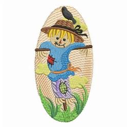Colorful scarecrow with a blue shirt and straw hat, a bird on its head, surrounded by green grass, perfect for fall decor.
