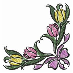 Vibrant tulip cluster featuring pink and yellow flowers, lush leaves, and a purple bow for spring decor.
