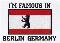 Bear graphic on a red and white striped flag with 'I'M FAMOUS IN BERLIN GERMANY' text.