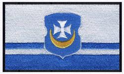 Traditional emblem style blue shield with a white cross and gold crescent moon, accented with blue and white stripes.