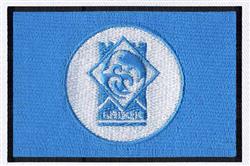 Circular emblem featuring a modern design with a light blue center on a blue background and a black border.