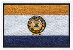 Flag design featuring a bold circular emblem with a wheat sheaf, in vibrant gold, white, and blue stripes.