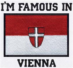 Bold flag with emblem featuring red and white stripes, centered emblem, and 'I'M FAMOUS IN' text in black.
