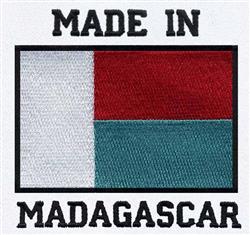 Patriotic flag of Madagascar with red, white, and green stripes, featuring bold black text, 'MADE IN' and 'MADAGASCAR'.