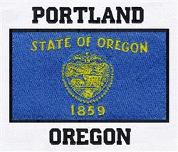 Oregon state flag featuring a blue background, yellow state seal, and bold black text 'PORTLAND' and 'OREGON'.