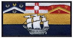 Detailed realistic sailing ship with vibrant red and gold flags against a blue background, perfect for nautical decor.