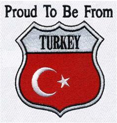 Applique shield with red background, white crescent and star, and 'Proud To Be From' text, perfect for patriotic apparel.