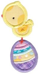 Applique yellow chick sitting on a purple Easter egg with pastel stripes, festive and colorful for spring.