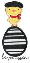 Applique cheerful yellow chick in a black beret and red scarf on a striped egg, perfect for playful Easter decor.