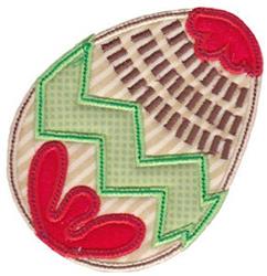 Applique egg with playful zigzag pattern in green and vibrant red leaf shapes, set against a tan and brown striped background