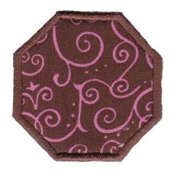 Applique octagonal fabric patch with brown background and whimsical pink swirl patterns, ideal for playful accessories.