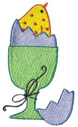 Colorful egg cup holding a polka dot yellow chick emerging from a blue eggshell, perfect for Easter decor.