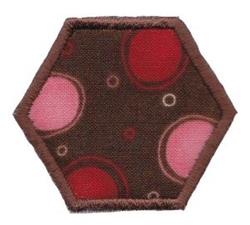 Applique hexagonal design with a rich brown background and vibrant red and pink circles.