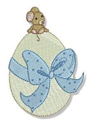 Playful mouse on pastel green egg with blue polka-dotted bow, perfect for Easter celebrations.