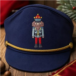 Nutcracker character cap featuring a detailed nutcracker design, gold trim, and a festive navy blue color, perfect for Christ