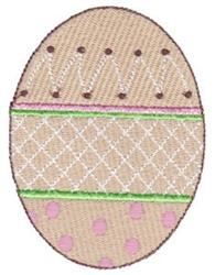 Decorative egg in pastel colors with playful polka dots and a green stripe, perfect for Easter decor.