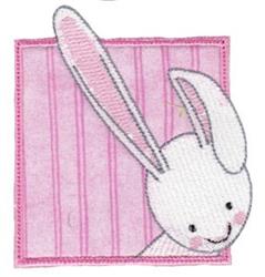 Whimsical rabbit design with long ears peeking from a pink square background with stripes, perfect for Easter crafts.