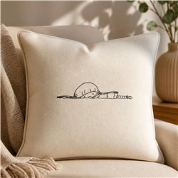 Redwork sleeping sloth on a natural beige pillow, featuring a plush texture, minimalist style, and cozy atmosphere.