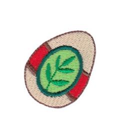Beige egg with red accents and green leaf design, showcasing playful embroidery for spring decor.