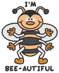 Playful cartoon bee with orange and black stripes and a cheerful smile, featuring the text 'I'M BEE-AUTIFUL' below.