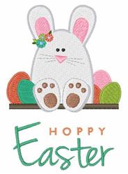 Cute bunny with pink ears and paws sits among colorful Easter eggs with 'Hoppy Easter' text, perfect for festive decor.