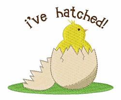 Chick applique with vibrant colors, emerges from a cracked egg on green grass, joyful spring and Easter theme.