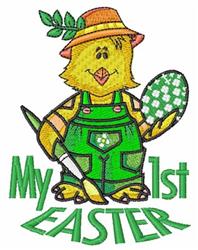 Cheerful chick in green overalls holds a painted Easter egg and paintbrush, with 'My 1st EASTER' text below. Colorful design