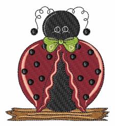 Whimsical ladybug applique with a black body, red spotted wings, and a green bow on a wooden base, perfect for spring.