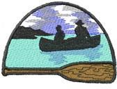 Canoe with two paddlers gliding through serene waters, framed by mountains and a cloudy sky, created as a machine embroidery