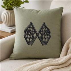 Crossed racing flags on a modern green pillow with textured background, showcasing stylish black embroidery.