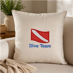 Dive flag cushion with light beige fabric, featuring a red flag with white stripe and blue 'Dive Team' text.