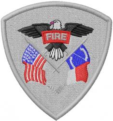 Applique eagle atop a red shield with 'FIRE', flanked by American and state flags in detailed embroidery.